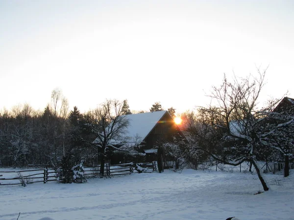 sunrise with snow in the village