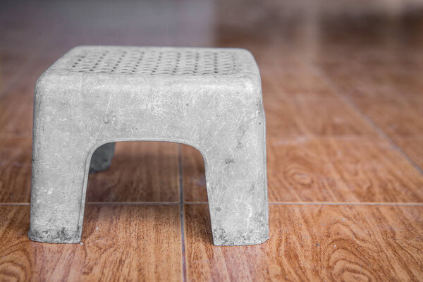 Old white plastic stool 