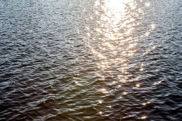 Sunlight reflected on the water — Stock Photo, Image