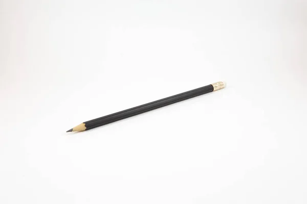 Black pencil on white background — Stock Photo, Image