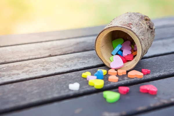 Many little heart colorful in a wooden cup — Stock Photo, Image