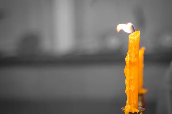 Yellow candle with flames — Stock Photo, Image