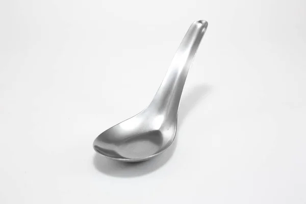 Stainless steel spoon on white background — Stock Photo, Image