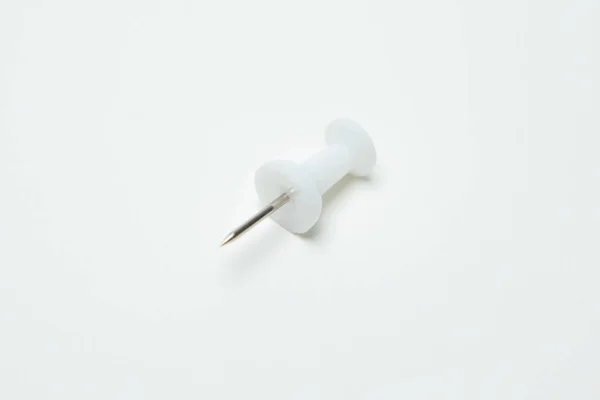 Close up of White pin on white background