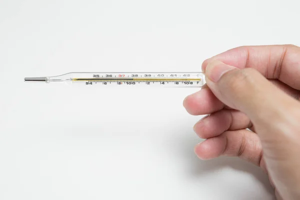 Eine Hand Hält Ein Thermometer Auf Weißem Hintergrund — Stockfoto