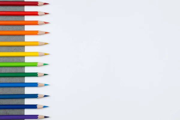 Pattern of Colorful Many colored pencils on a white paper background and copy space
