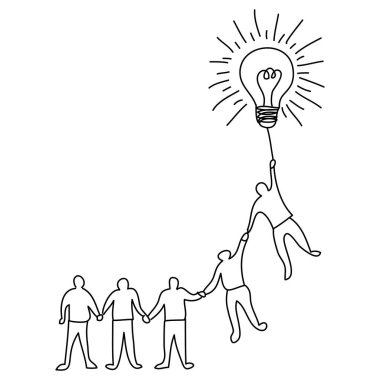 Bir takım üyesinin çizimi bir fikri sembolize eden büyük bir ampulle el ele veriyor.