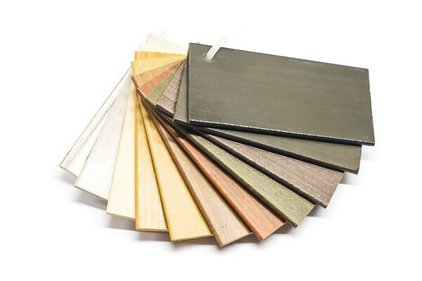 Isolated stacked prefinished hardwood flooring samples.