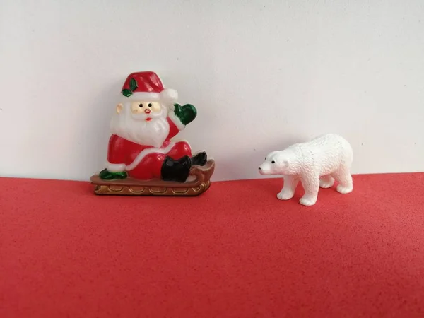 Cheerful Greeting Santa Claus Polar Bear Red White Background Shot — Stock Photo, Image