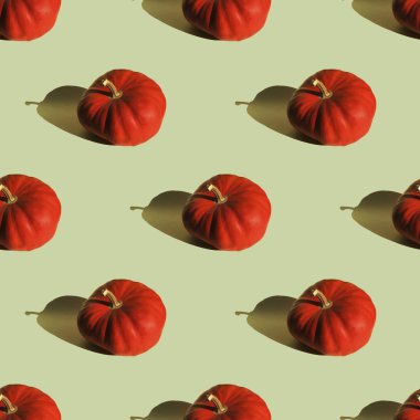 Dikişsiz desen turuncu kabak açık yeşil arka plan izole. Tekstil, duvar kağıdı, sarma için Halloween sembolü.