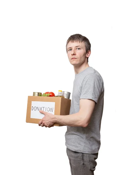 Joven Hombre Caucásico Voluntario Sosteniendo Comida Comestibles Caja Donación Cartón —  Fotos de Stock