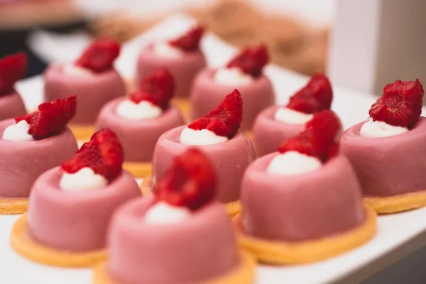 catering food on table, sweet dessert cakes with strawberries