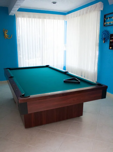 pool table, blue room