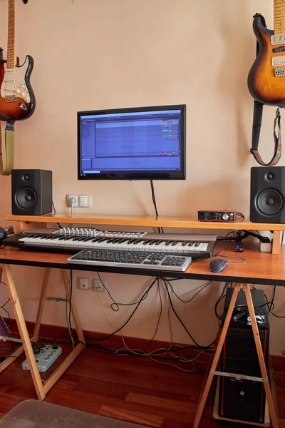 Audio Home Studio equipped with midi keyboard, monitors, sound card, guitar, amplifier and pedals