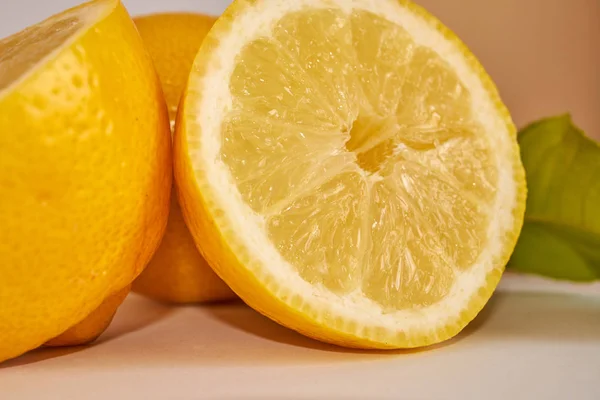 lemons cut with lemon leaves