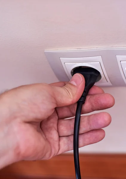 Connecting a male plug to a female.