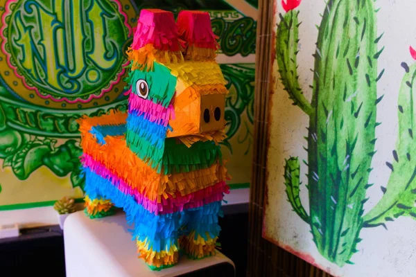 A colorful pinata in a mexican restaurant as decoration — Stock Photo, Image
