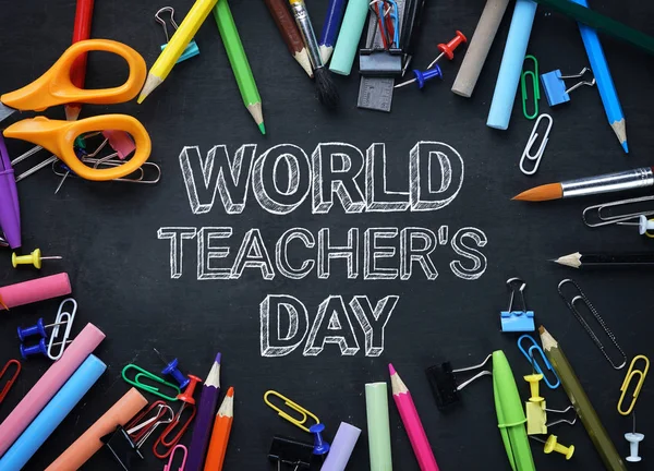 World Teacher\'s Day Text. School Stationary Top View on Blackboard