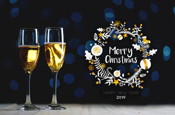 Merry Christmas Typography Art. Two Glasses of Champagne Dark Glow Lights Background