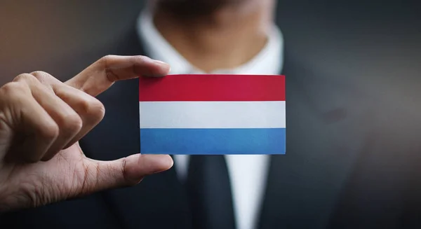 Businessman Holding Card Luxembourg Flag — Stock Photo, Image