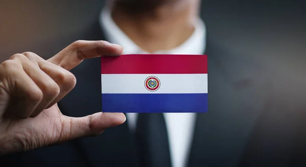 Businessman Holding Card Paraguay Flag — Stock Photo, Image