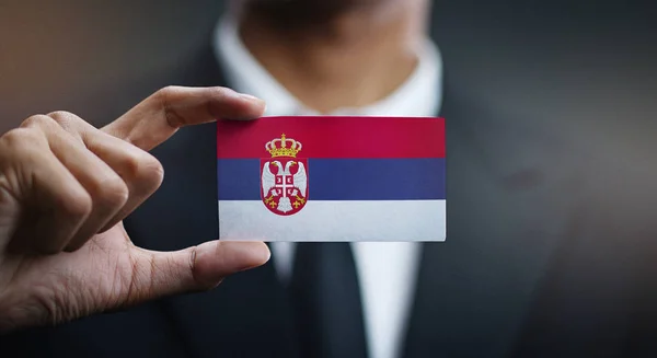 Businessman Holding Card Serbia Flag — Stock Photo, Image