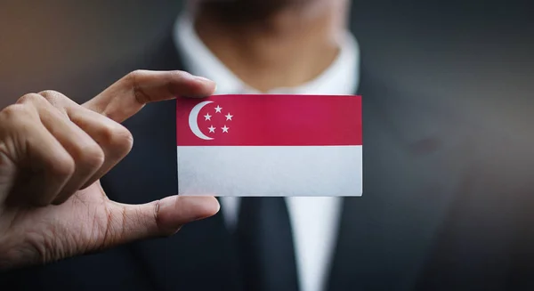 Businessman Holding Card Singapore Flag — Stock Photo, Image