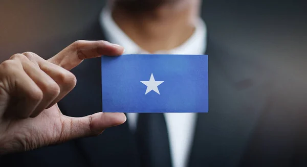 Businessman Holding Card Somalia Flag — Stock Photo, Image