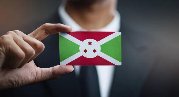 Businessman Holding Card Burundi Flag — Stock Photo, Image
