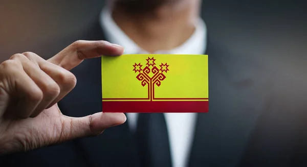 Businessman Holding Card of Chuvashia Flag