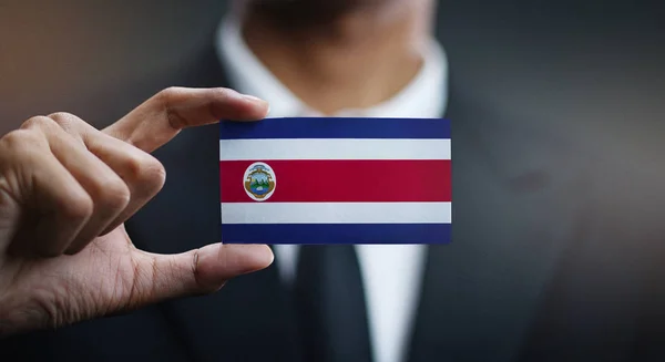 Empresário Segurando Cartão Bandeira Costa Rica — Fotografia de Stock