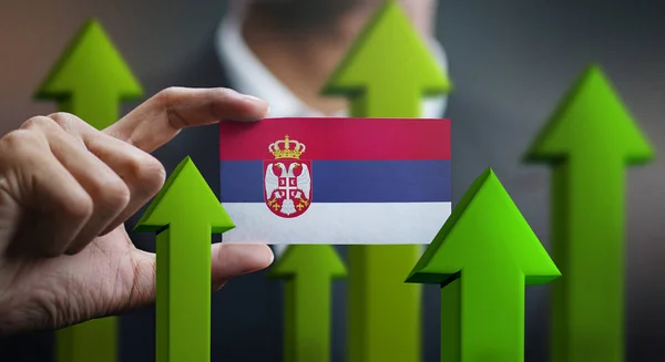 Nation Growth Concept Green Arrows Businessman Holding Card Serbia Flag — Stock Photo, Image