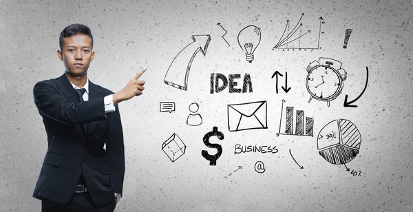 Aziatische zakenman wijzend Business sketch concept — Stockfoto