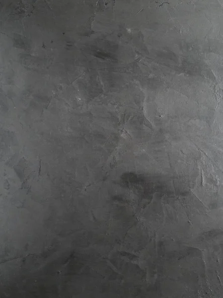 Eski boyalı siyah arka plan. Grunge doku. Koyu duvar kağıdı. Kaba kaba yapısı ile koyu dokulu duvar closeup. Metniniz veya resminiz için alan olarak kullanılabilir