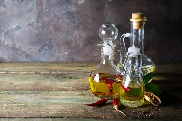 Bottles Different Kinds Vegetable Oil Flax Pepper Sesame Wooden Background — Stock Photo, Image