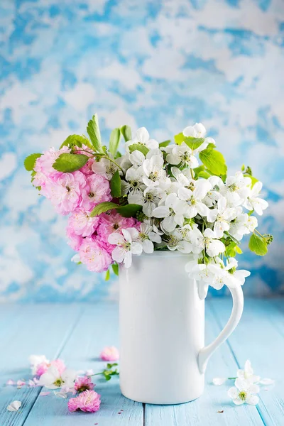 Lovely wild flowers bunch in ceramic vase on table in wooden background . Valentines or mothers day — Stock Photo, Image