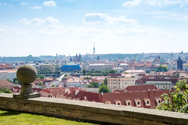 Prague Praha old town view at historical center from the hill. Tiled red roofs in old European city in summertime. Stone decor object globe on pedestal — Stock Photo, Image