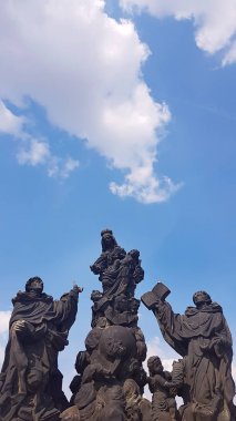 statues of Madonna, St Dominic, St Thomas Aquinas, Charles Bridge Karluv most , Prague, Czech Republic clipart