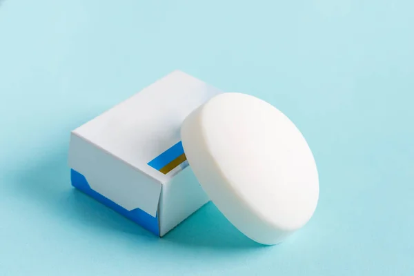 Soap wrap Box Mock-up package and bar soap isolated on blue background