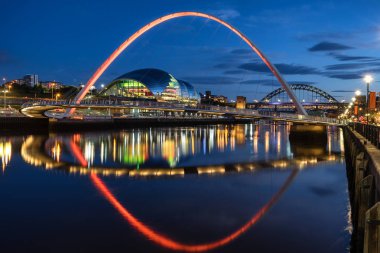 Gateshead Millennium Bridge across the River Tyne between Newcastle and Gateshead clipart