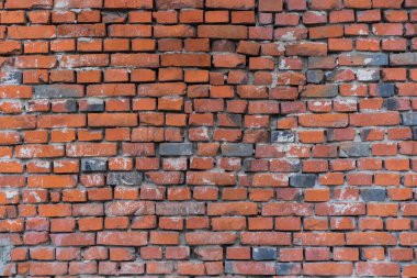 tuğla kırmızı duvar. Eski bir tuğla evin arka planı.