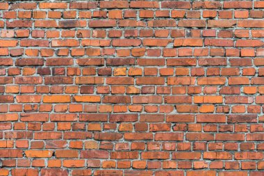 tuğla kırmızı duvar. Eski bir tuğla evin arka planı.