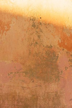 Soyut boya dokusuna sahip beton bir arka plan. Eski turuncu boyalı duvarın arka planı. Roma duvar dokusu arka planı, Roma İtalya