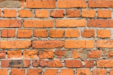 Tuğla kırmızı duvar dokusu. Eski bir tuğla evin arka planı.