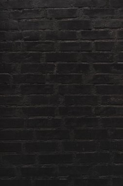 Tuğla siyah duvar dokusu. Eski bir tuğla evin arka planı.