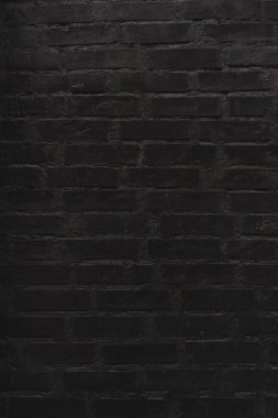 Tuğla siyah duvar dokusu. Eski bir tuğla evin arka planı.