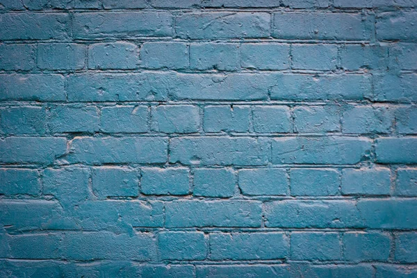 brick blue wall. background of a old brick house.