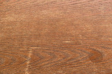 Kahverengi ahşap dokuda çatlaklar ve çizikler, tam çerçeve.