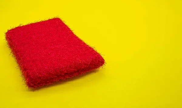 The scouring pad or kitchen sponge is a type of sponge used to scrub dishes and kitchen utensils