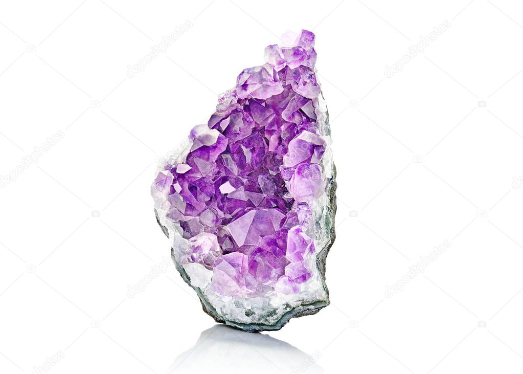 Violet Crystal Stone macro mineral. Purple rough Amethyst quartz crystals geode on white background, Uruguay